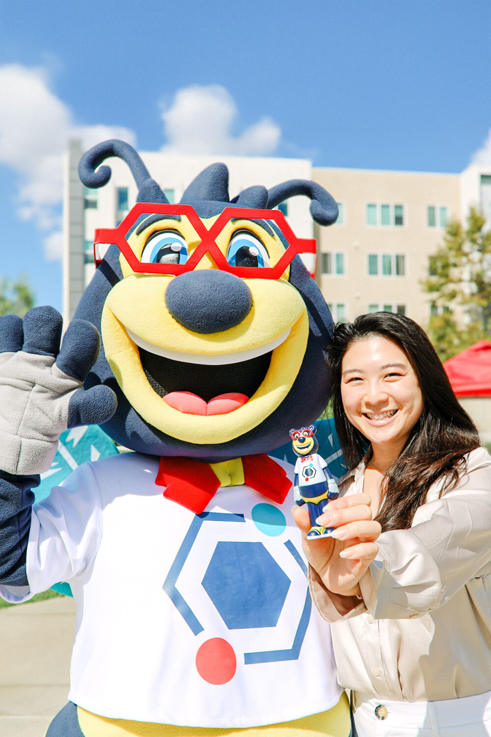 KGI student with beaker bee