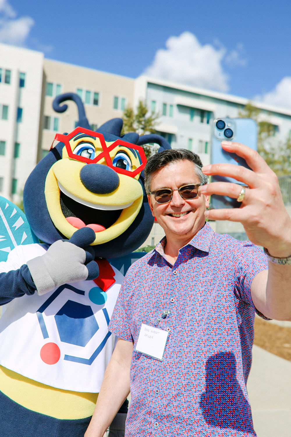 KGI student with beaker bee