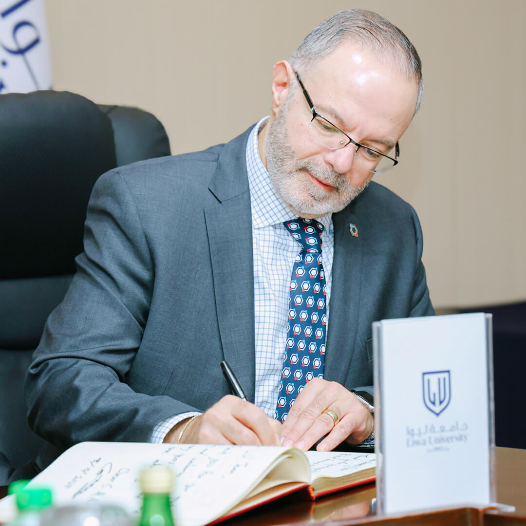 KGI president signing document